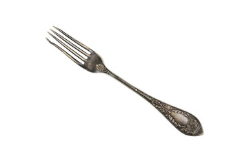 Top view of an old fork with embossed patterns on the handle. The teeth are bent