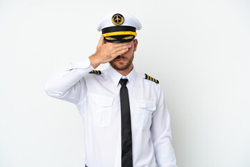 Airplane Brazilian pilot isolated on white background covering eyes by hands. Do not want to see something © luismolinero
