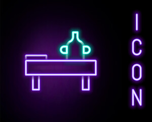 Glowing neon line Massage table with oil icon isolated on black background. Colorful outline concept. Vector