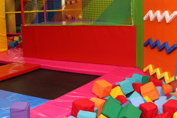 Trampoline, climbing wall at children's playroom, entertainment center