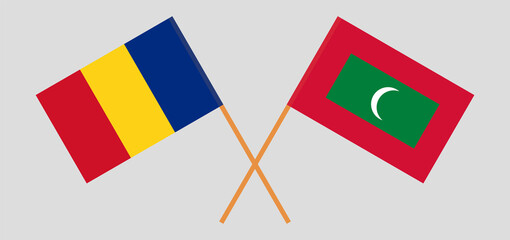 Crossed flags of Romania and Maldives. Official colors. Correct proportion