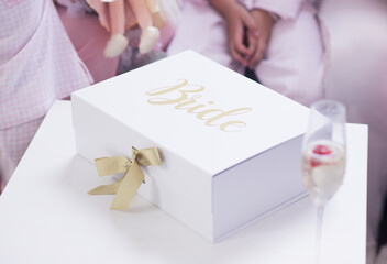 Bridal white and gold gift box with bride and champagne - Powered by Adobe