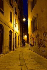 Fototapeta premium The one of many deserted narrow cozy streets in Cagliari, Sardinia, Italy.