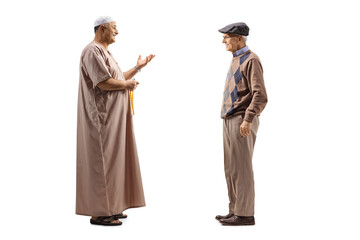 Fototapeta na wymiar Full length profile shot of a muslim man talking to an elderly man