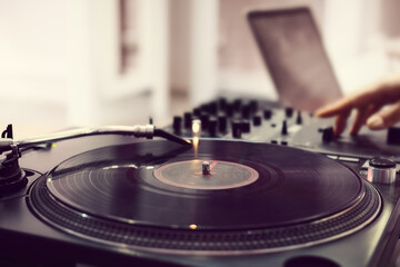 Dj playing record vinyl on turntable, no face