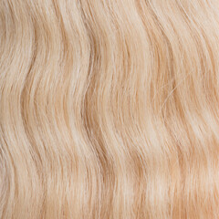 Naklejka premium Human hair wig on a mannequin. Back view. Blonde. Straight hair