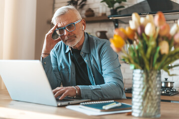 Psychological worry, migraine. A man with a problem in a home interior. Online consultation with a...