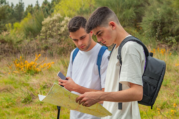 young people on a trip looking at the map