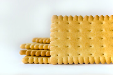 Biscuit with holes on white background. Close up macro shot of snacks. copy paste space