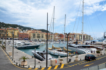 Luxury yachts moored at harbour in port of Nice on the Mediterranean Sea on the French Riviera or Cote d'Azur in France.