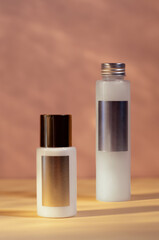 cosmetics set, skin care, cream tube with gold cap, body lotion with silver cap, shower gel