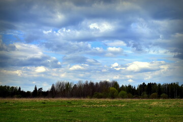 clouds over the field in spring
