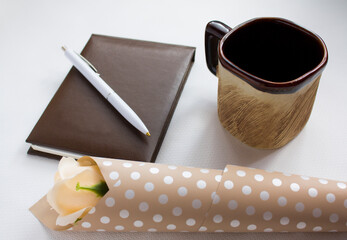Office table with supply and coffe cup. View from above.