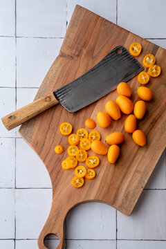 Kumquats on cutting board