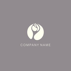 A symbol or logo of a simple, minimalistic, stylized flower bud and leaves shape, consisting of several elements. Made with spots formed in a circle