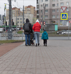 family walking on the street
