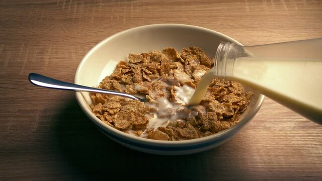 Milk Pours On Cereal Breakfast