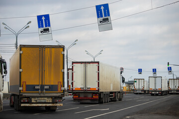 a long traffic jam of many trucks at the border , a long wait for customs checks between States due to the coronavirus epidemic, increased sanitary inspection of cargo transport