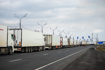 a long traffic jam of many trucks at the border , a long wait for customs checks between States due to the coronavirus epidemic, increased sanitary inspection of cargo transport