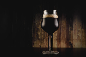 Dark craft beer in the old bar