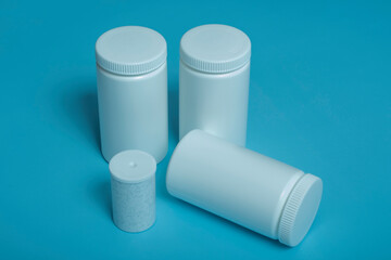 mockup white plastic jars on colored background.copy space.