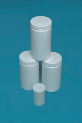 mockup of white plastic cans on a colored background. with place for text. vertical photo