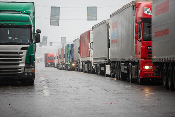 a long traffic jam of many trucks at the border , a long wait for customs checks between States due...
