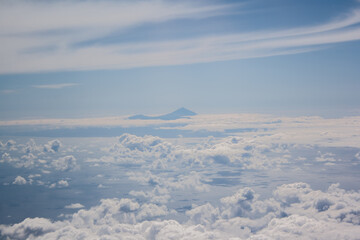 Teide volcano, on the island of Tenerife, among the clouds in an aerial view.