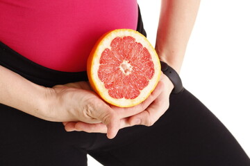 person woman holding a juice grapefruit
