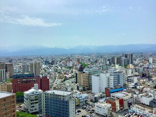 Scenery of Toyama city and Tateyama mountain range seen from the observation deck of Toyama city