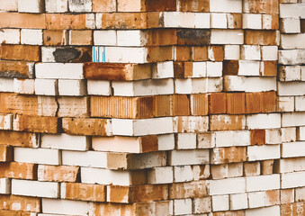 Heap of old white and brown bricks texture background