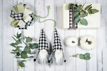 On-trend farmhouse aesthetic flatlay flatlay with farmhouse style decor, stack of books, and bows...