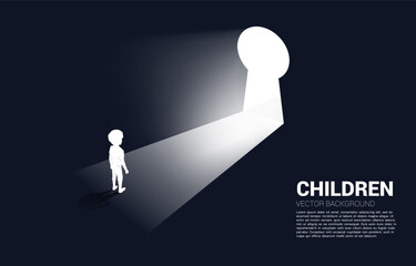 silhouette of kid ready to move out to key hole door. Concept of children education and learning.