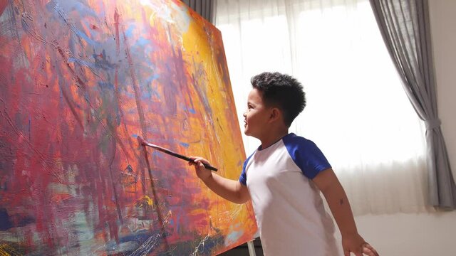 Little Boy Painting Abstract At Home
