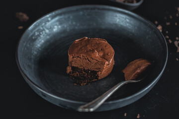Chocolate muffin with fork served on table