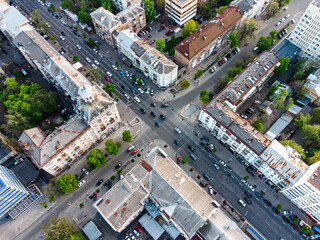 View of downtown city intersection with a lot of cars and architecture © Oleh Rode