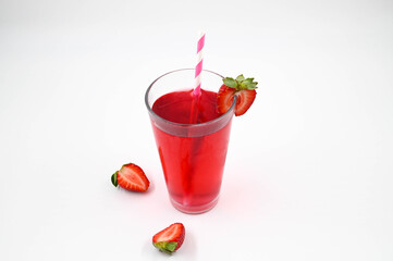 Strawberry cocktail in a glass with strawberries on the edge of the glass