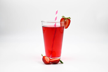 Strawberry cocktail in a glass with strawberries on the edge of the glass