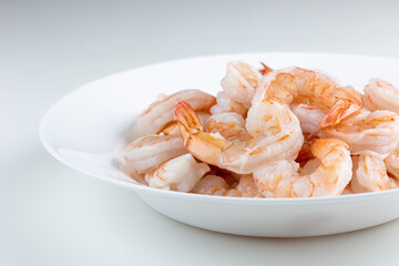 Fresh raw prawns on white background.
