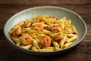 Penne pasta with grilled shrimp.