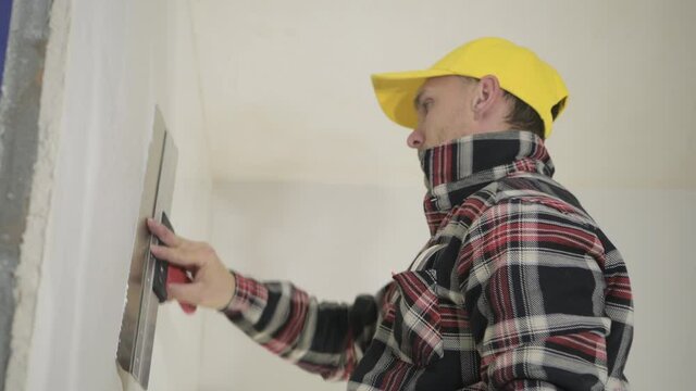 Residential Drywall Patching by Caucasian Worker
