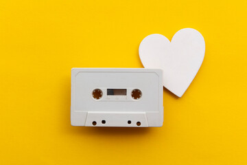 retro audio cassette tape surrounded by white love hearts
