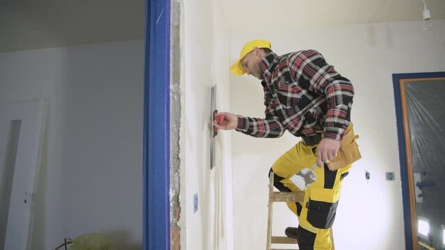 Caucasian Contractor Wall Patching