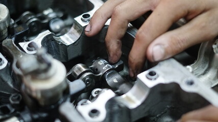 Engine repair, A mechanic repairing the engine In the auto repair center Replacement of spare parts and maintenance. Some auto repair centers Open as a learning resource for practicing technicians.
