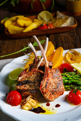 Lamb chops marinated in herbs with green asparagus and lime