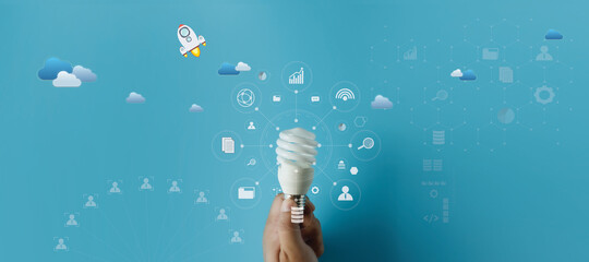 light bulb idea energy hand holding light bulb on blue background Innovative idea Concept ...