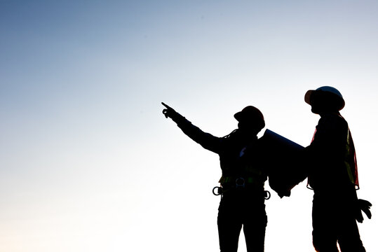 Engineers discussion with architects work planing in construction site