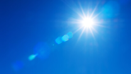 Natural background of sky and bright sun with soft effect.   sky background in soft colors with rays and highlights