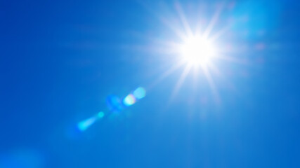 Natural background of sky and bright sun with soft effect.   sky background in soft colors with rays and highlights