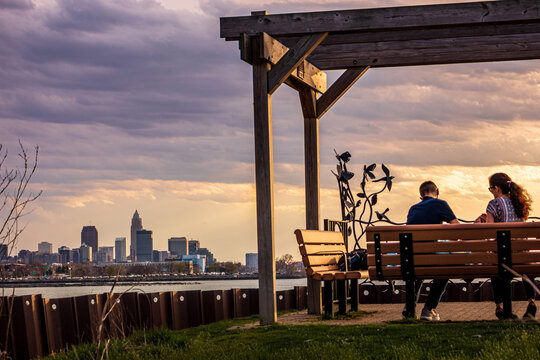 Couple on bench at sunset